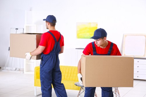 Moving van and packed boxes for house removals in Watford