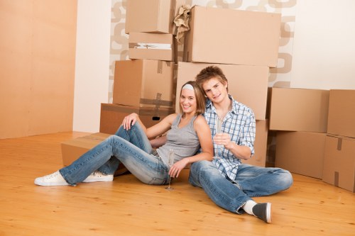 Removal van and moving boxes in a Watford residential street