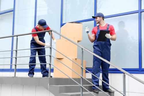 Removal team planning a house move in Watford street setting