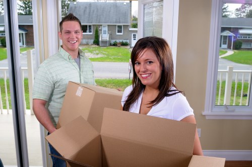 Professional man and van service handling household items in Watford