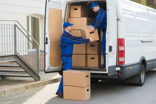 Unpacking boxes into a new home as part of Watford moving services