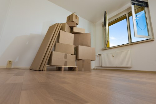 Furniture and boxed belongings being handled during a Watford relocation