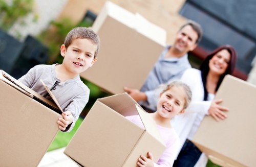 Packed boxes and furniture prepared for a Watford relocation