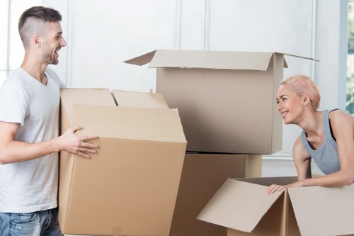 Furniture and boxes being moved into a van for Watford removals