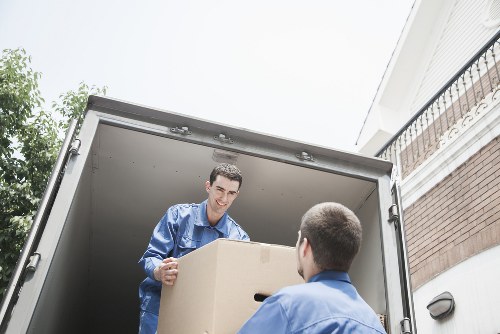 Packed moving boxes ready for transport in Watford