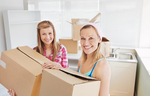 Organized storage unit with packed boxes and furniture