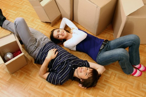 Moving team handling furniture carefully during a removals job