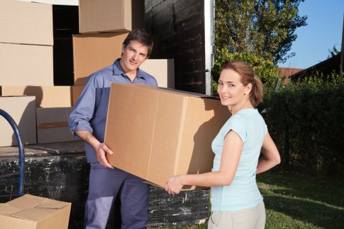 Packed moving boxes ready for flat removals in Watford